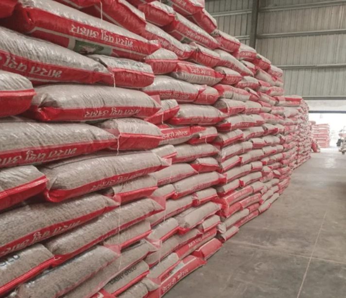 Stacked compound cattle feed bags at a regional distributor warehouse