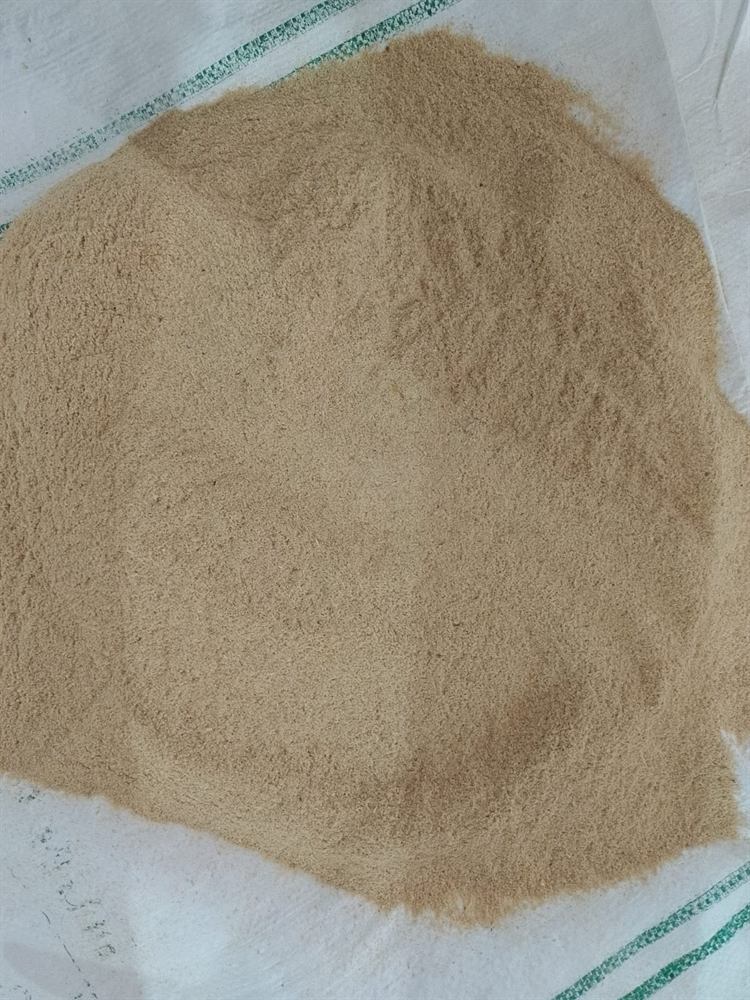 Close-up of super fine wheat bran on a feed-grade woven plastic bag